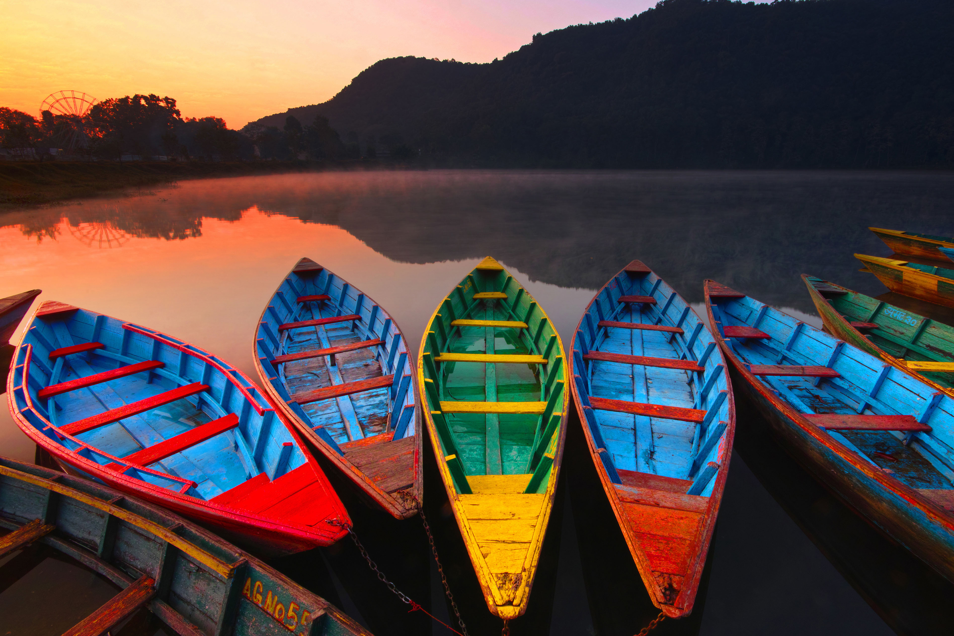 Colourful boats on phewan lake sunrise
